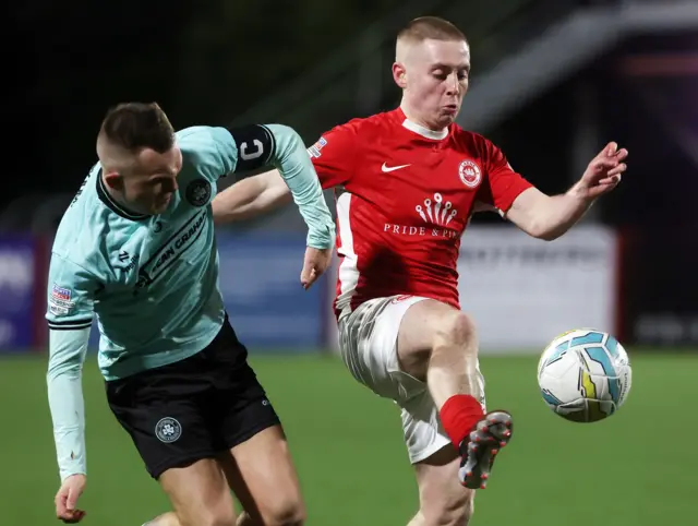 Rory Hale and Conor McKendry in action