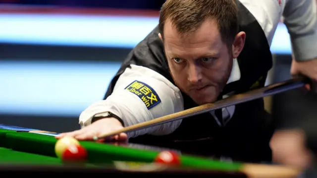 Mark Allen plays a shot at the Masters