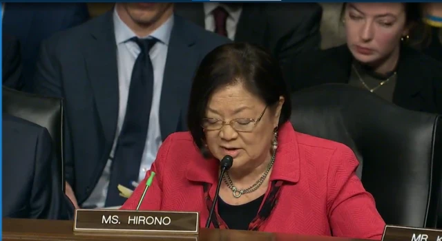 Mazie Hirono speaking into a micrphone