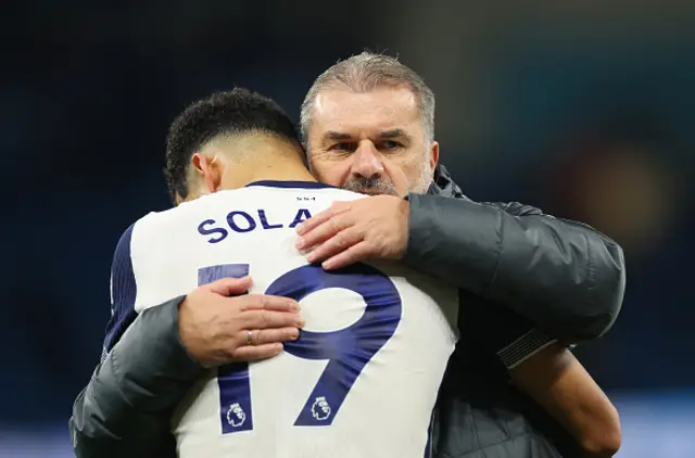 : Ange Postecoglou, Manager of Tottenham Hotspur, interacts with Dominic Solanke