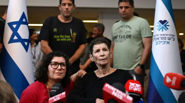 Yocheved Lifshitz (C) speaks to the media alongside her daughter Sharone Lifschitz (L) outside Ichilov Hospital after she was released by Hamas last night, on October 24, 2023 in Tel Aviv, Israel.