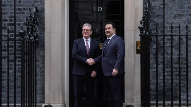 Prime Minister Keir Starmer shakes hands with Iraqi Prime Minister Mohammed Shia al-Sudani outside of 10 Downing Street ahead of talks.