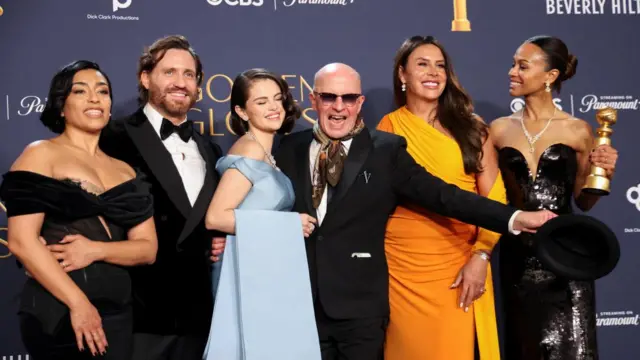 Adriana Paz, Edgar Ramirez, Selena Gomez, Jacques Audiard, Karla Sofia Gascon, and Zoe Saldana, winners of the Best Motion Picture - Musical or Comedy award for "Emilia Perez," pose at the 82nd Golden Globe Awards in Beverly Hills, California, U.S., January 5, 2025