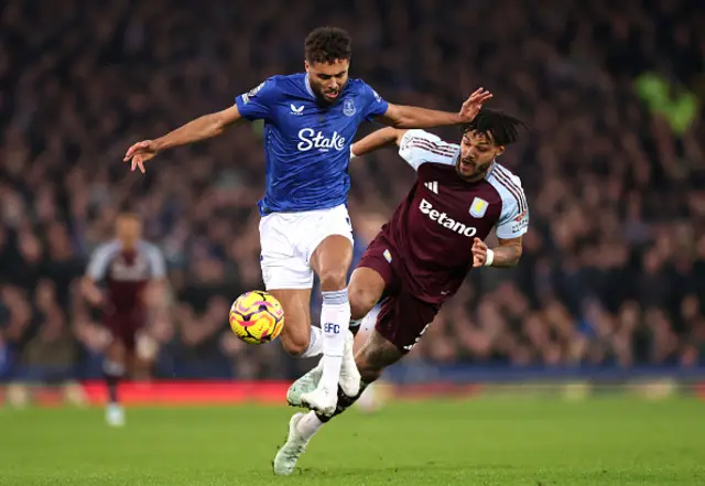 Dominic Calvert-Lewin of Everton clashes with Tyrone Mings