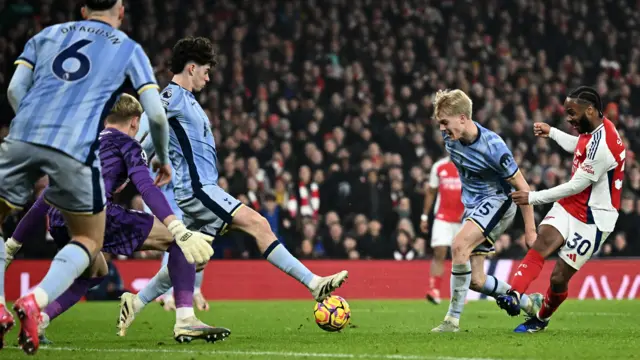 Tottenham Hotspur's Archie Gray in action with Arsenal's Raheem Sterling