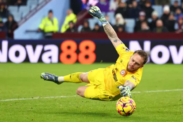 Mark Flekken making a save for Brentford against Aston Villa