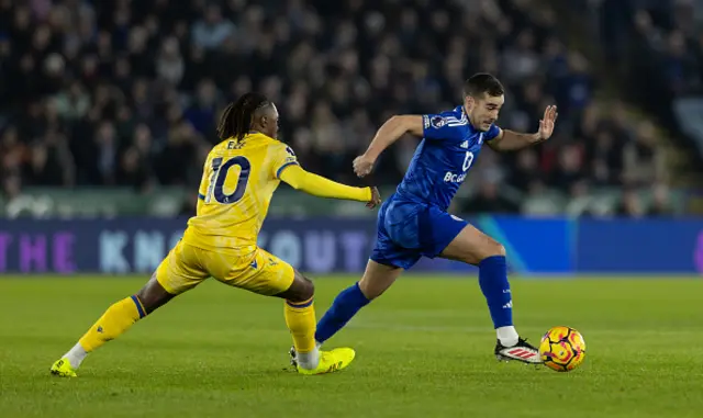 Leicester City's Harry Winks breaks away from Crystal Palace's Eberechi Eze