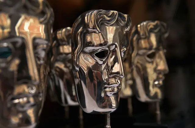 A file photo from a previous year of Bafta awards, shaped like masks, lined up