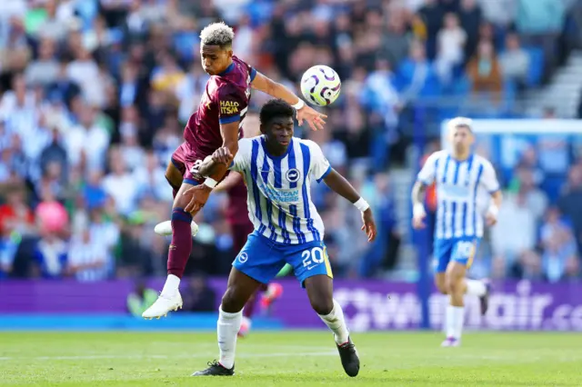 Carlos Baleba of Brighton is challenged by Omari Hutchinson of Ipswich Town