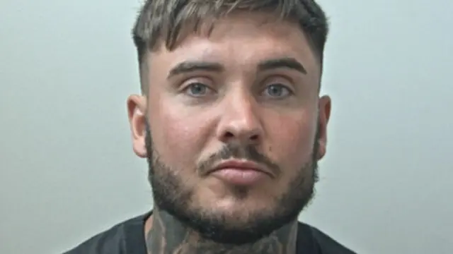 Custody image of Ryan Wellings who has brown hair, beard and tattoos on his neck