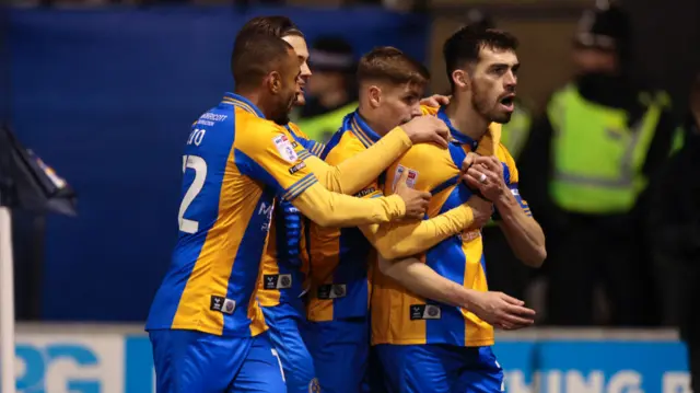 Shrewsbury players celebrate John Marquis' goal