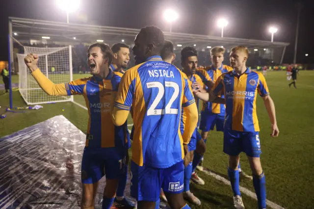 Shrewsbury players celebrate John Marquis' second goal