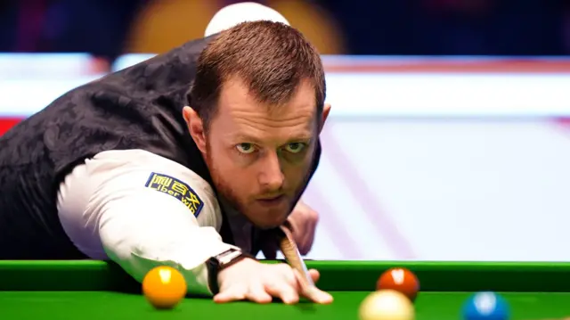 Mark Allen plays a shot