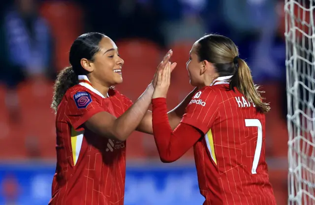 Olivia Smith of Liverpool celebrates with teammate Cornelia Kapocs after scoring