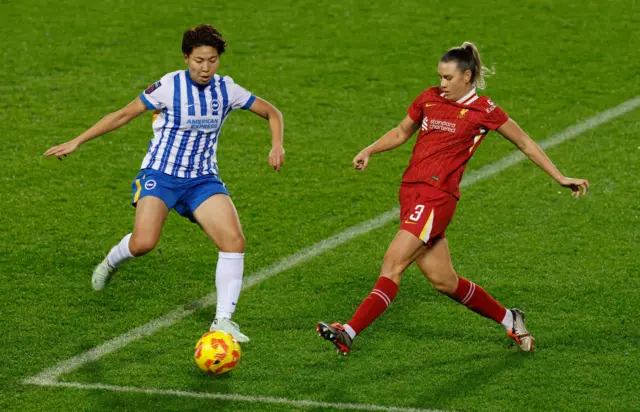 Brighton & Hove Albion's Kiko Seike in action with Liverpool's Gemma Evans