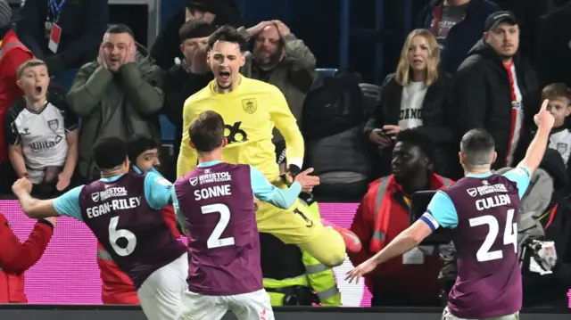 Burnley goalkeeper James Trafford celebrates saving Wilson Isidor of Sunderland second penalty of the game