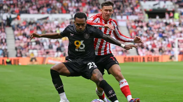 Burnley's Lucas Pires and Sunderland's Chris Rigg battle for the ball