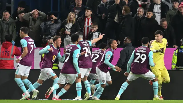 Burnley players celebrate Wilson Isidor's saved penalty