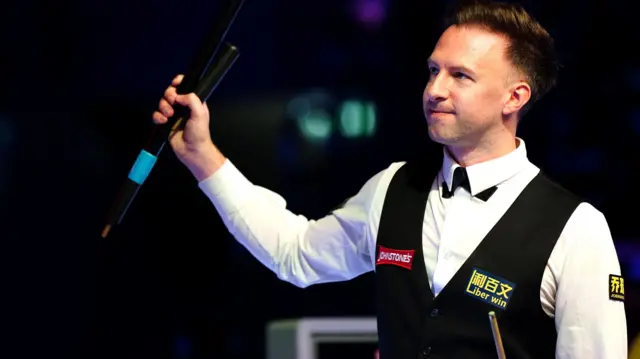 Judd Trump celebrates a win at the Masters