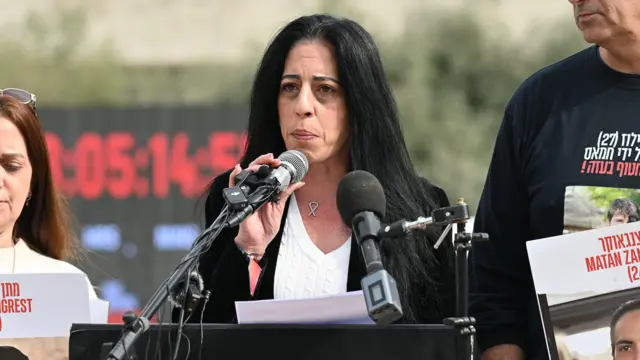 Einav Zangauker speaking at a podium at a event in Tel Aviv on Friday 17 Jan 2025