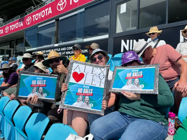 Fans with Alex Hartley signs at the Women's Ashes