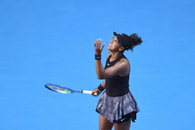 Naomi Osaka of Japan reacts in the Women's Singles Third Round match against Belinda Bencic of Switzerland