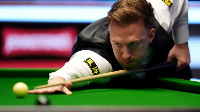 Judd Trump plays a shot at the Masters