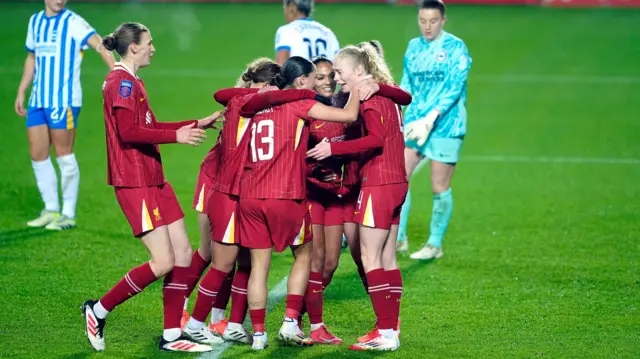 Liverpool players celebrate their second goal