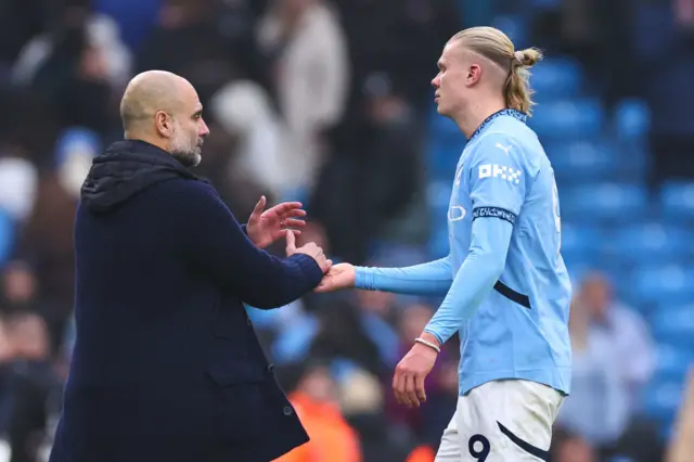 Erling Haaland and Pep shake hands