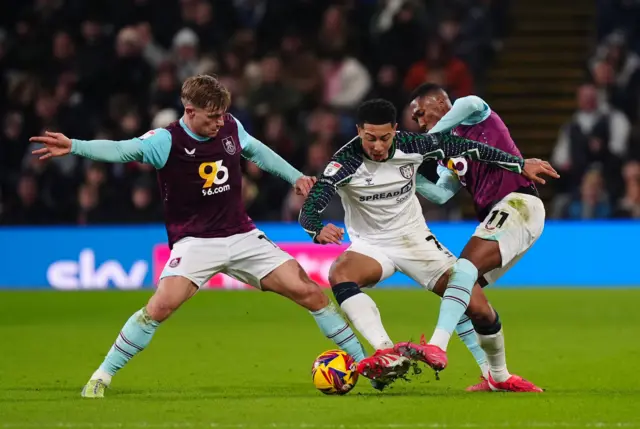 Sunderland's Jobe Bellingham (centre) battles with Burnley's Zian Flemming (left) and Jaidon Anthony