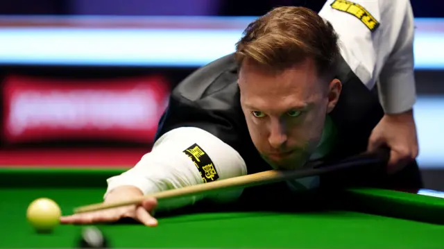 Judd Trump plays a shot at the Masters