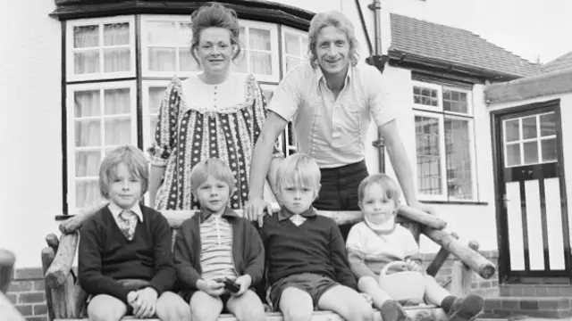 Denis Law, Manchester City football player, pictured at home with family