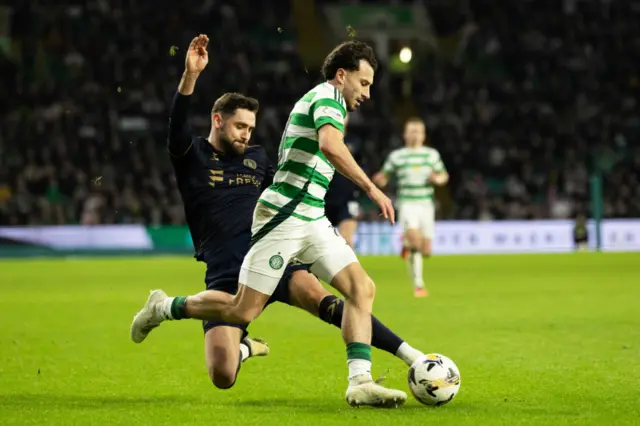 Celtic’s Nicolas Kuhn and Kilmarnock's Robbie Deas in action during a Scottish Gas Men's Scottish Cup Fourth Round match between Celtic and Kilmarnock at Celtic Park, on January 18, 2025, in Glasgow, Scotland. (Photo by Craig Foy / SNS Group)