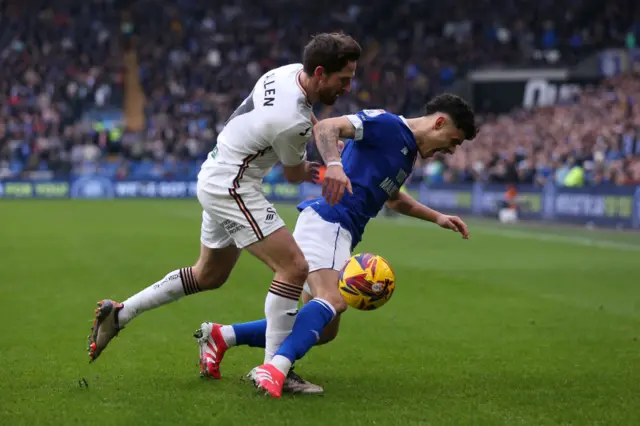 Swansea's Joe Allen clatters into Cardiff's Alex Robertson