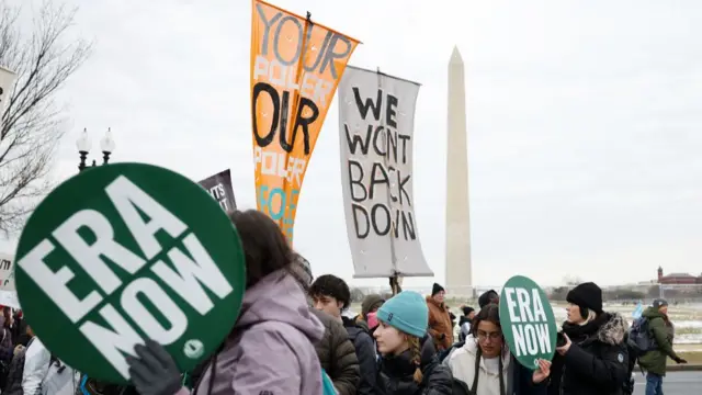 Protesters walking past the Washington monument