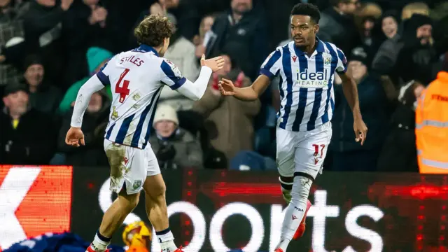 Grady Diangana is congratulated by Callum Styles after his equaliser