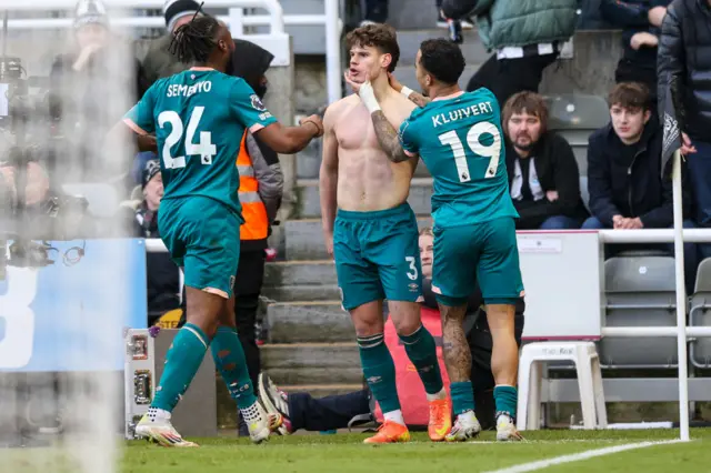 Milos Kerkez of Bournemouth is is congratulated by team-mates Antoine Semenyo and Justin Kluivert