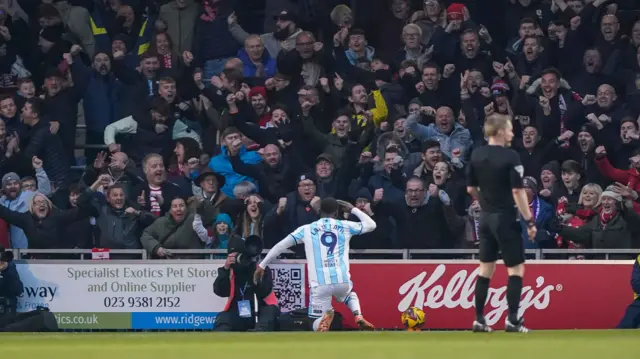 Emmanuel Latte Lath salutes the travelling Boro fans