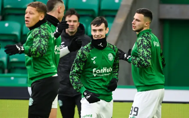 Mykola Kuharevich (right) warming up at Easter Road