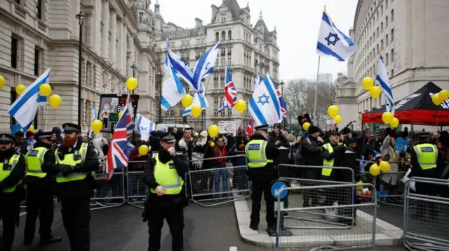 Pro-Israel activists stage a counter-rally to a pro-Palestinian demonstration on Whitehall in London
