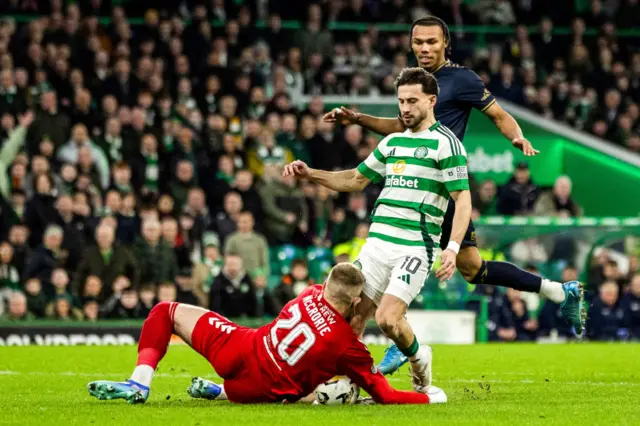 Kilmarnock’s Robby McCrorie collides with Celtic’s Nicolas Kuhn during a Scottish Gas Men's Scottish Cup Fourth Round match between Celtic and Kilmarnock at Celtic Park, on January 18, 2025, in Glasgow, Scotland.