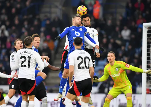 Jamie Vardy of Leicester City with Antonee Robinson of Fulham