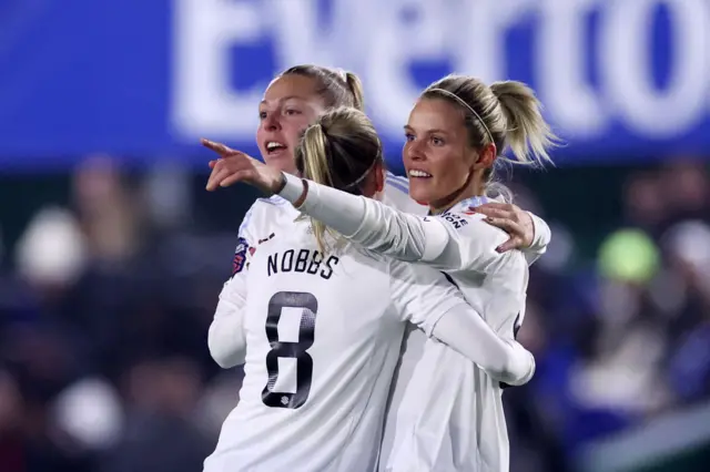 Daly celebrates scoring the opening goal with teammates