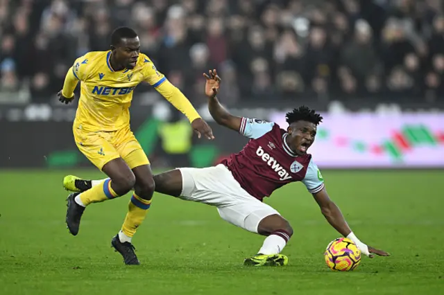 Tyrick Mitchell of Crystal Palace battles for possession with Mohammed Kudus