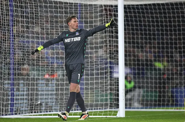 Dean Henderson looks on