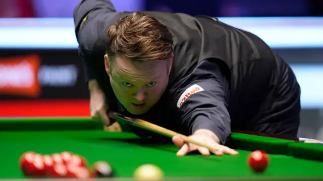 Shaun Murphy plays a shot