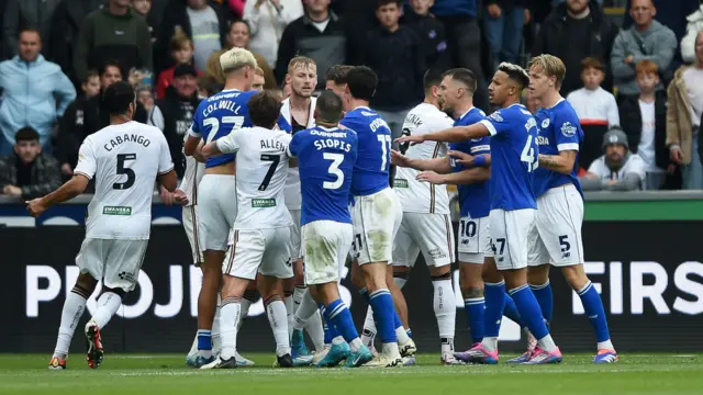 Swansea and Cardiff players clash during their meeting last August