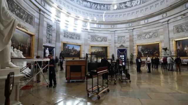 People stand at the rotunda where the inaugural address will take place