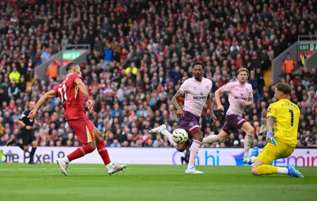 Mohamed Salah has a shot against Brentford in the Premier League