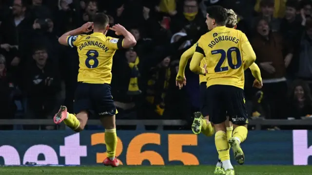 Cameron Brannagan cups his ear to the crowd after scoring against Blackburn